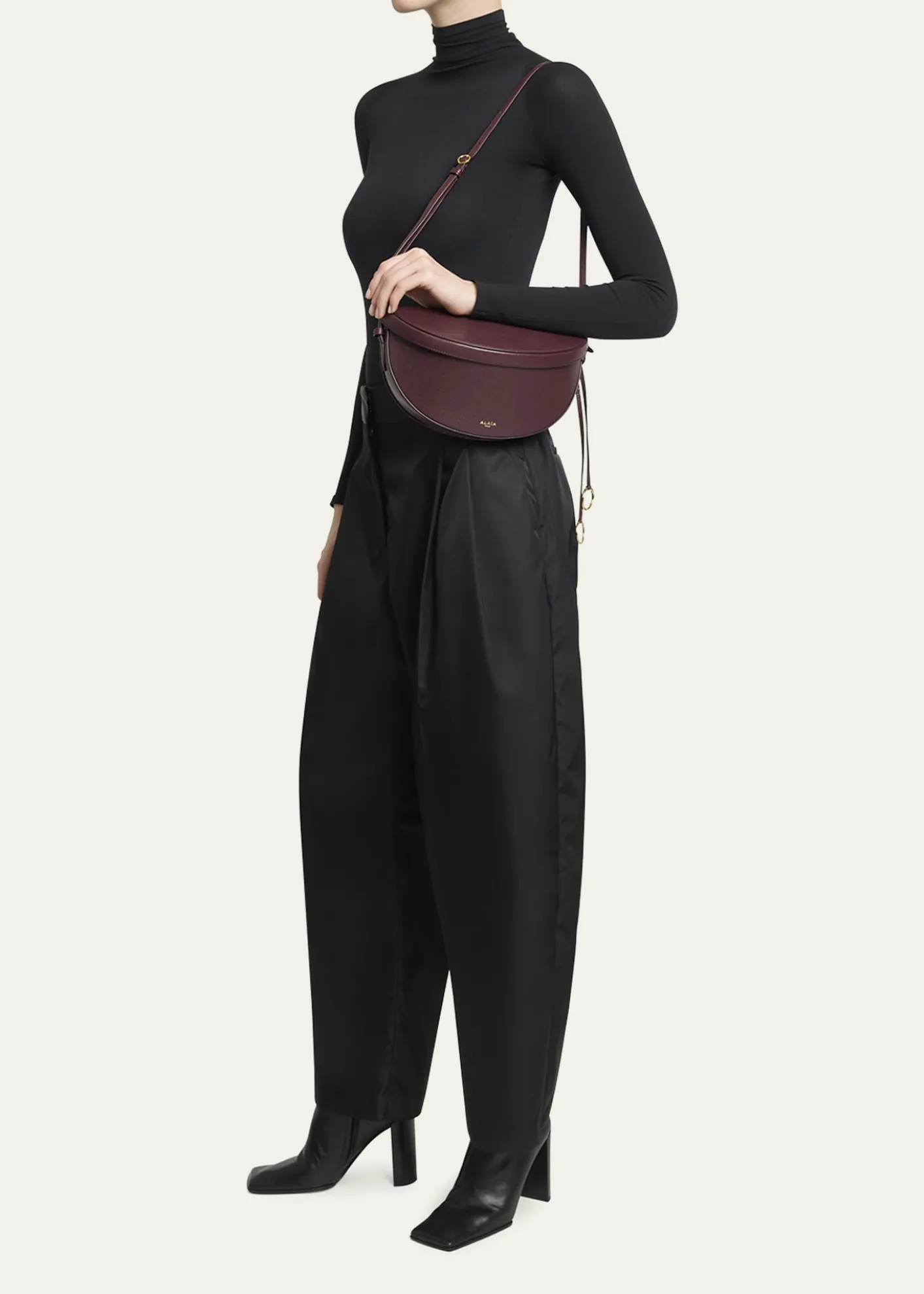 ALAIAEast-West Curved Goatskin Leather Shoulder Bag